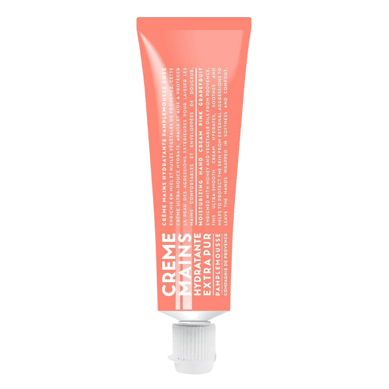 Rosa Handcreme-Tube mit der Aufschrift 'CREME MAINS HYDRATANTE EXTRA PUR PINK GRAPEFRUIT'.