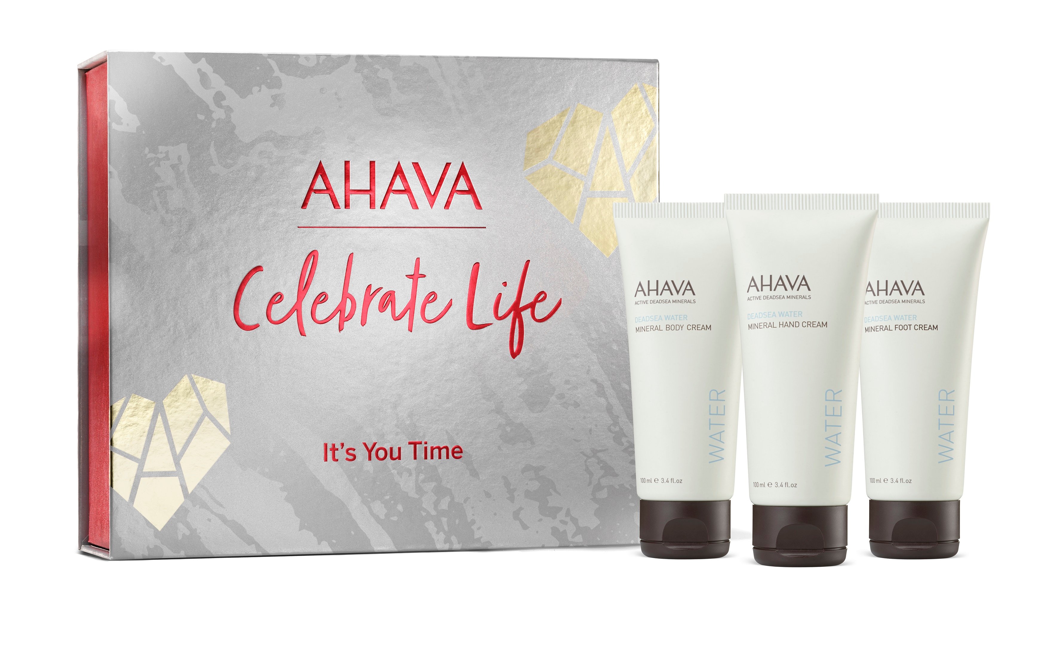 0697045016150 AHAVA Geschenkset mit drei Mineralcremes vor einer grauen Box mit rotem Text 'Celebrate Life'.