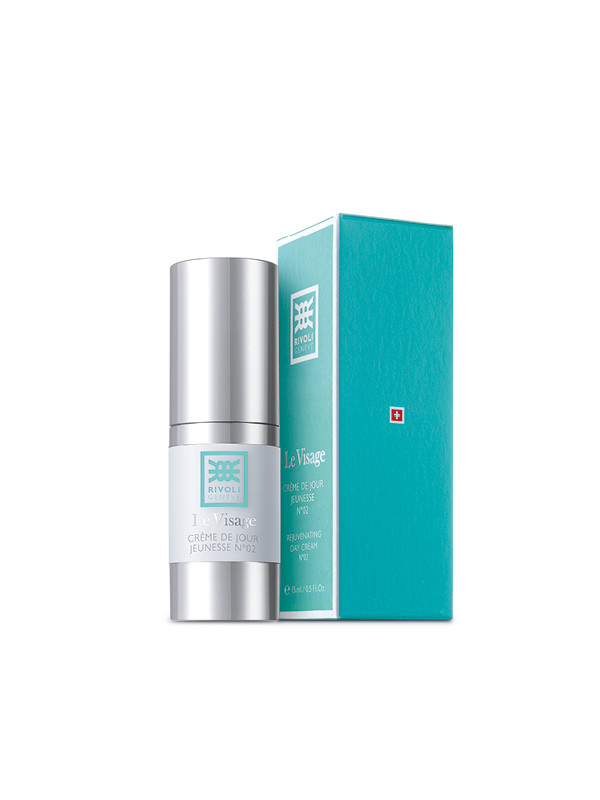 Ein silberner Spender und eine türkisfarbene Verpackung der Rivoli Le Visage Crème de Jour Jeunesse N°02.