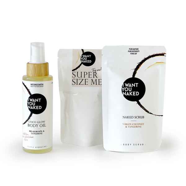 Drei Produkte von 'I Want You Naked': Körperöl, Peeling und Körperpeeling in weißer Verpackung mit schwarzem Logo.